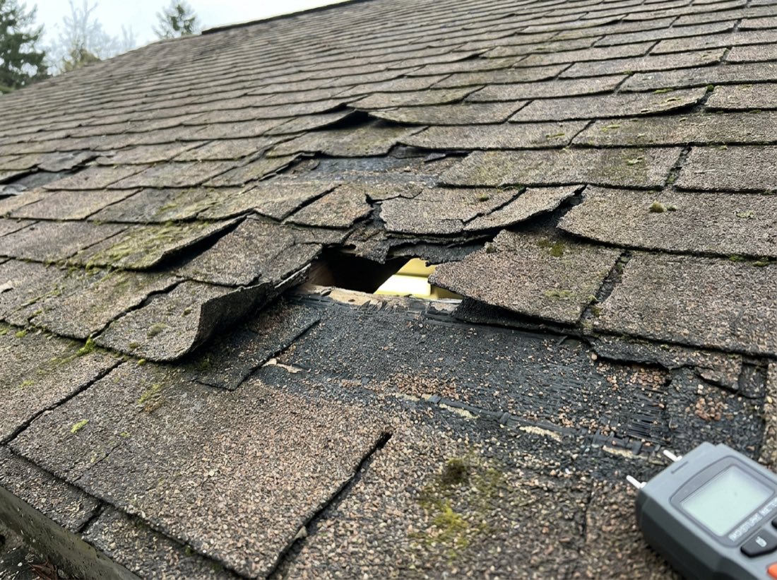 Cracked, curling, and missing shingles with granule loss